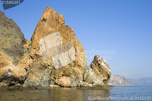 Image of Mountain on a rocky coastline.View from sea.