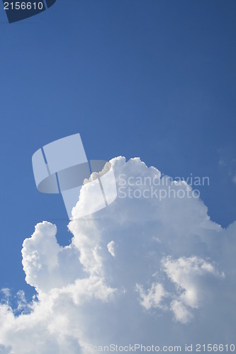 Image of Puffy clouds on blue sky