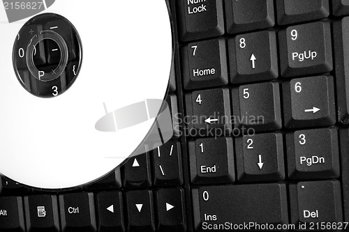 Image of White CD on a laptop keyboard