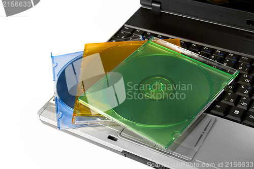 Image of Colored cd`s on a laptop