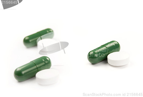 Image of Green and white pills isolated