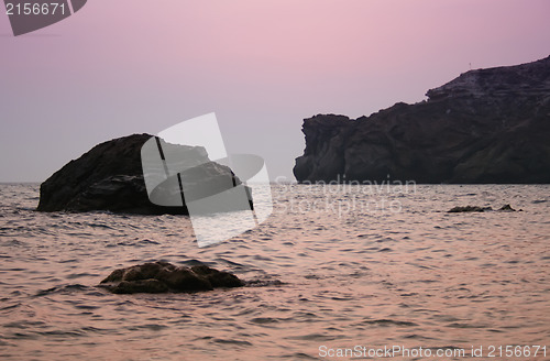 Image of Sunset sea rocky beach