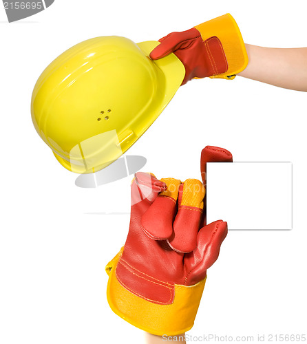 Image of Red glove holding an empty frame and glove holding a yellow hard