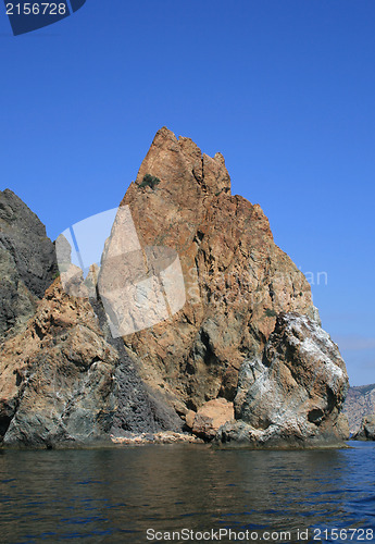 Image of Mountain on a rocky coastline.View from sea.