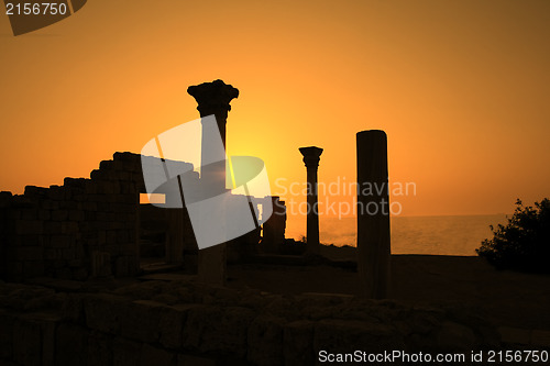 Image of Ancient ruins during sunset with sea at background