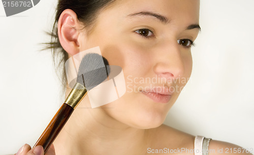 Image of Girl putting make-up