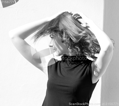 Image of Fashion portraits of a model with awesome shaking hair