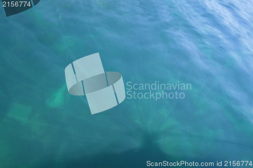 Image of Rays of light falling into the sea.Close up to the waves surface