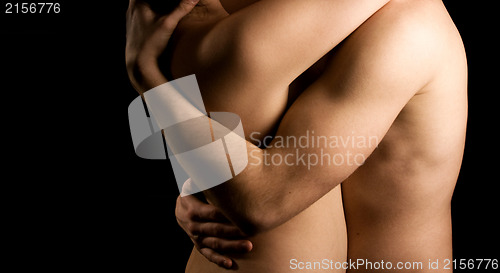 Image of Hands hugging a girl in passion