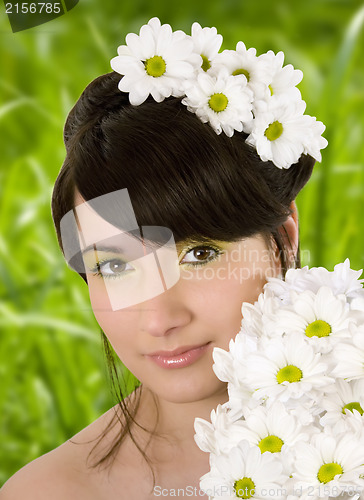 Image of Girl with spring flowers.Glamor effect.