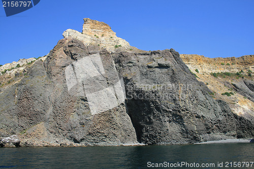 Image of Mountain on a rocky coastline.View from sea.