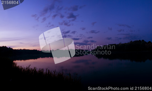 Image of Romantic sunset on the lake with fog