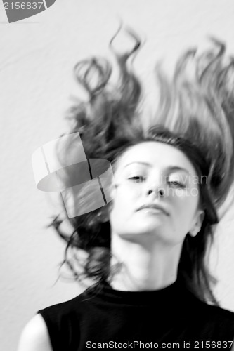 Image of Fashion portraits of a model with awesome shaking hair