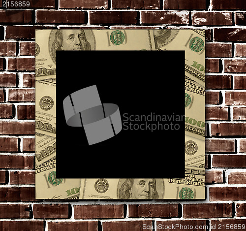 Image of Empty dollars frame on a grunge brick wall