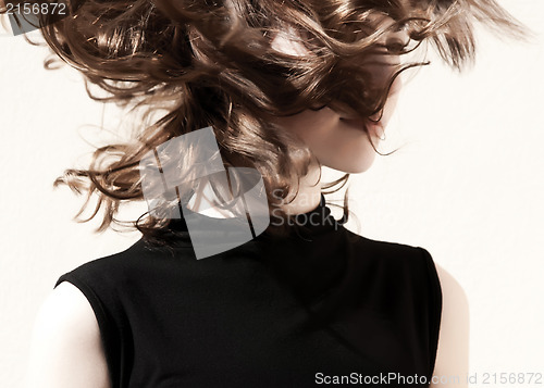 Image of Fashion portraits of a model with awesome shaking hair