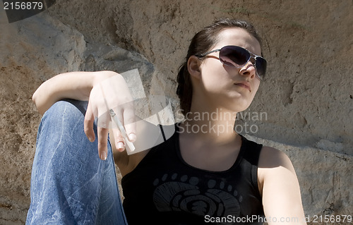 Image of Smoking a cigarette. Urban style