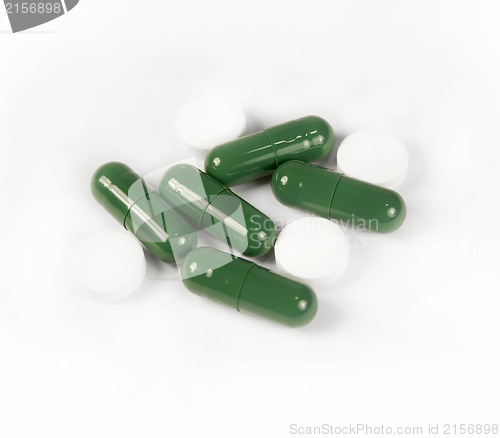 Image of Green and white pills isolated