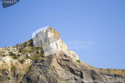 Image of Mountain on a rocky coastline.View from sea.