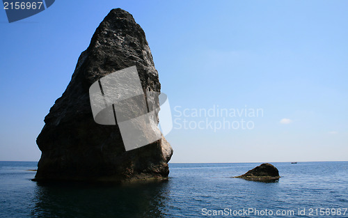 Image of Rocks and endless sea with clear blue sky