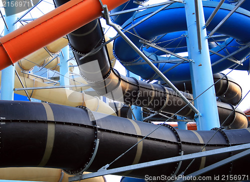 Image of Twisting, colorful water chutes wind around