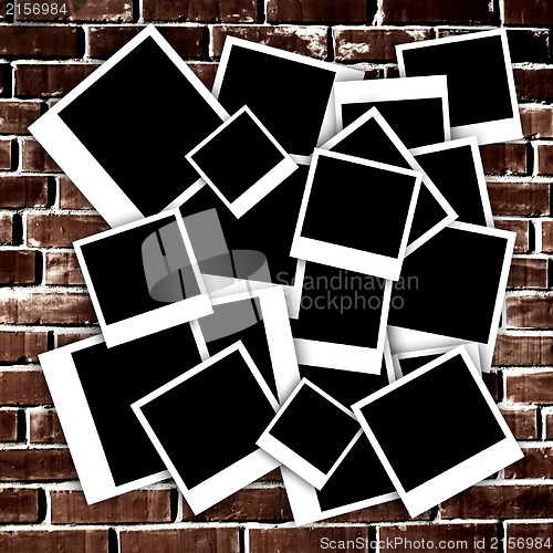 Image of Empty instant photos on grunge brick wall background
