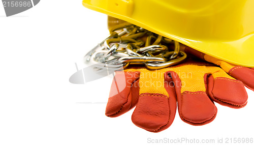 Image of Yellow hard hat, protective gloves and steel chain isolated