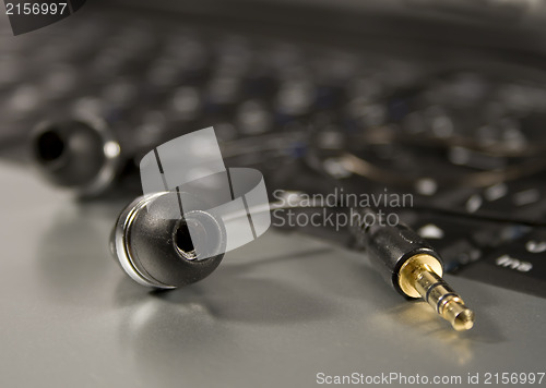 Image of Modern Headphones on a laptop keyboard