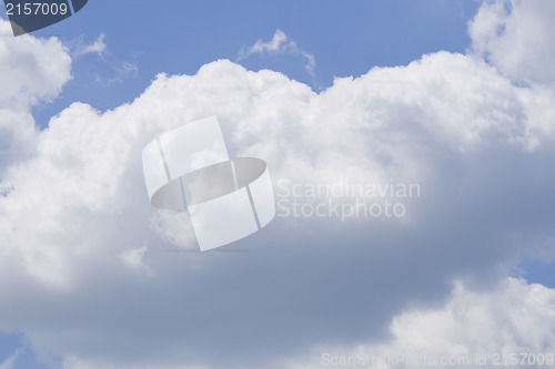 Image of Puffy clouds on blue sky