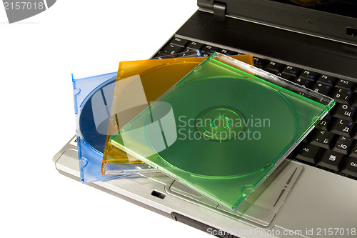Image of Colored cd`s on a laptop