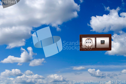 Image of Electric outlet with blue sky background