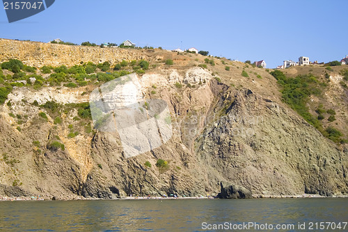 Image of Mountain on a rocky coastline.View from sea.