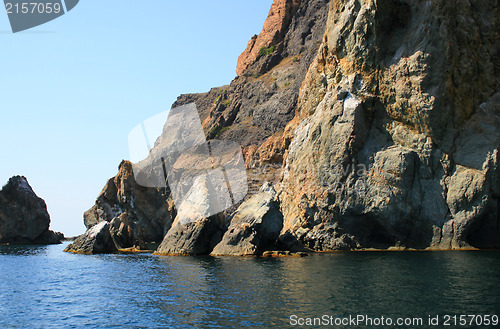 Image of Mountain on a rocky coastline.View from sea.