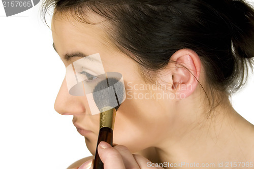 Image of Sexy girl putting make-up