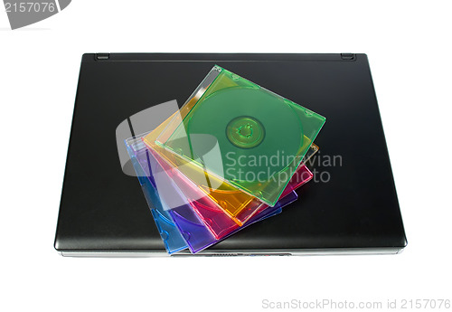 Image of Colored cd`s on a laptop isolated