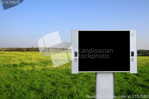 Image of Blank advertising billboard with spring field background