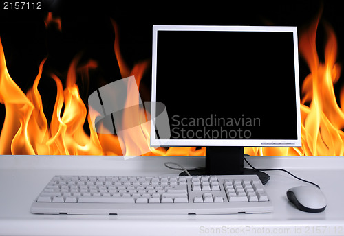 Image of PC with black desktop and fire flames background