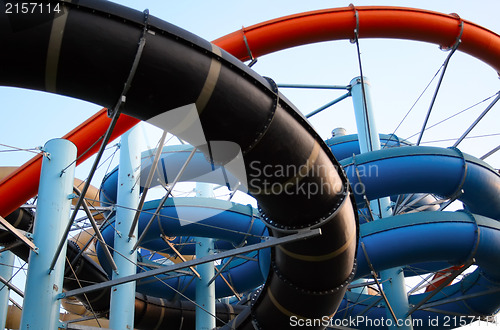 Image of Twisting, colorful water chutes wind around