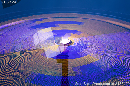Image of Danger carousel - big wheel in motion at night