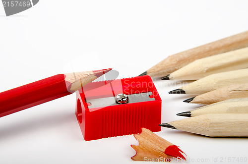 Image of Group of wooden pencils and red sharpener