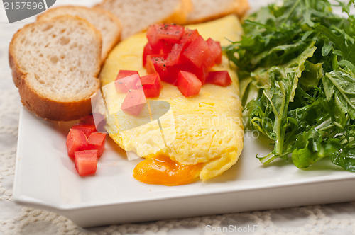 Image of cheese ometette with tomato and salad