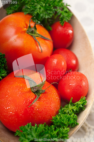 Image of tomatoes on a wood bowl