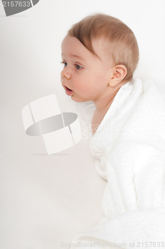 Image of Little boy in white blanket
