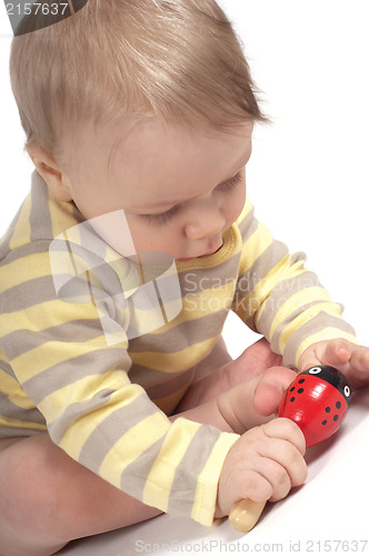 Image of Little cute boy with toy