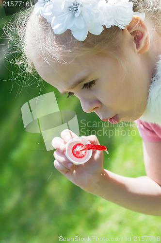 Image of Girl blow bubbles