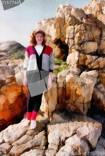 Image of Young Girl In SUmmer Sun at Sea on Rocks