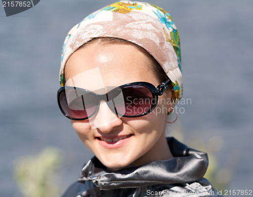 Image of portrait of beautiful girl in the bandana and sunglasses