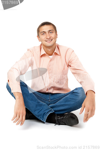 Image of Smiling man sitting in the lotus position