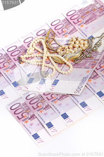 Image of 500 euro notes with jewellery