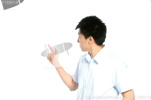Image of Asian man pointing behind him