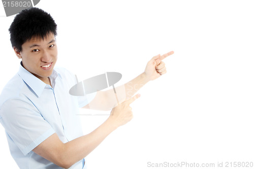 Image of Asian man pointing with both hands
